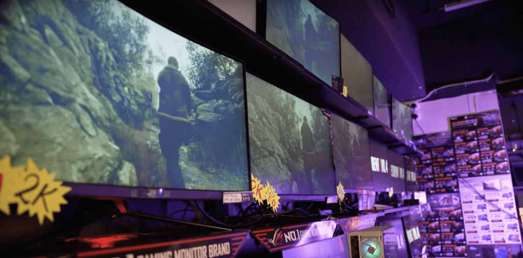 Several monitor screens being displayed in the shop.