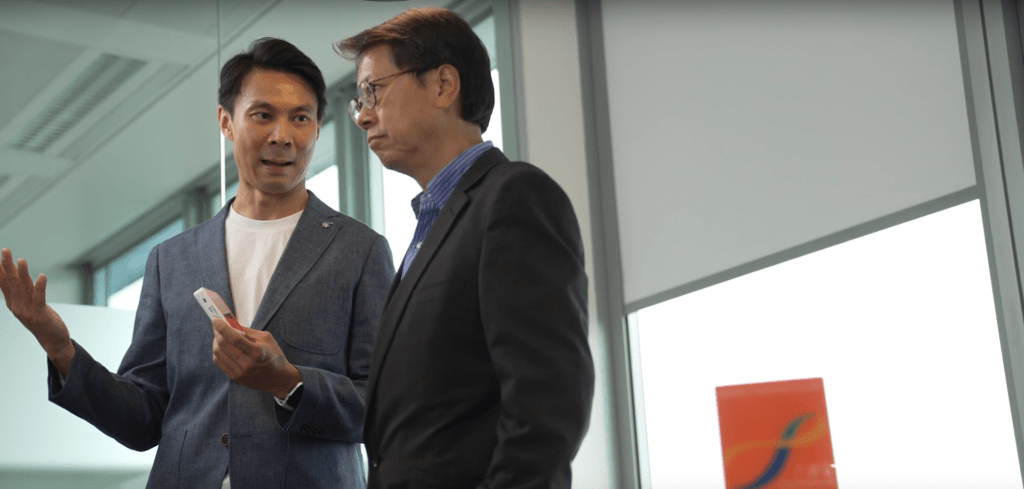 Two men talking with each other.